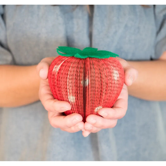 Decorative fruit formed from vintage books